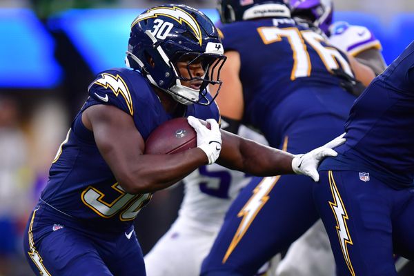 Oct 23, 2025; Inglewood, California, USA; Los Angeles Chargers running back Kimani Vidal (30) rushes the ball against the Minnesota Vikings during the first half at SoFi Stadium. Mandatory Credit: Gary A. Vasquez-Imagn Images