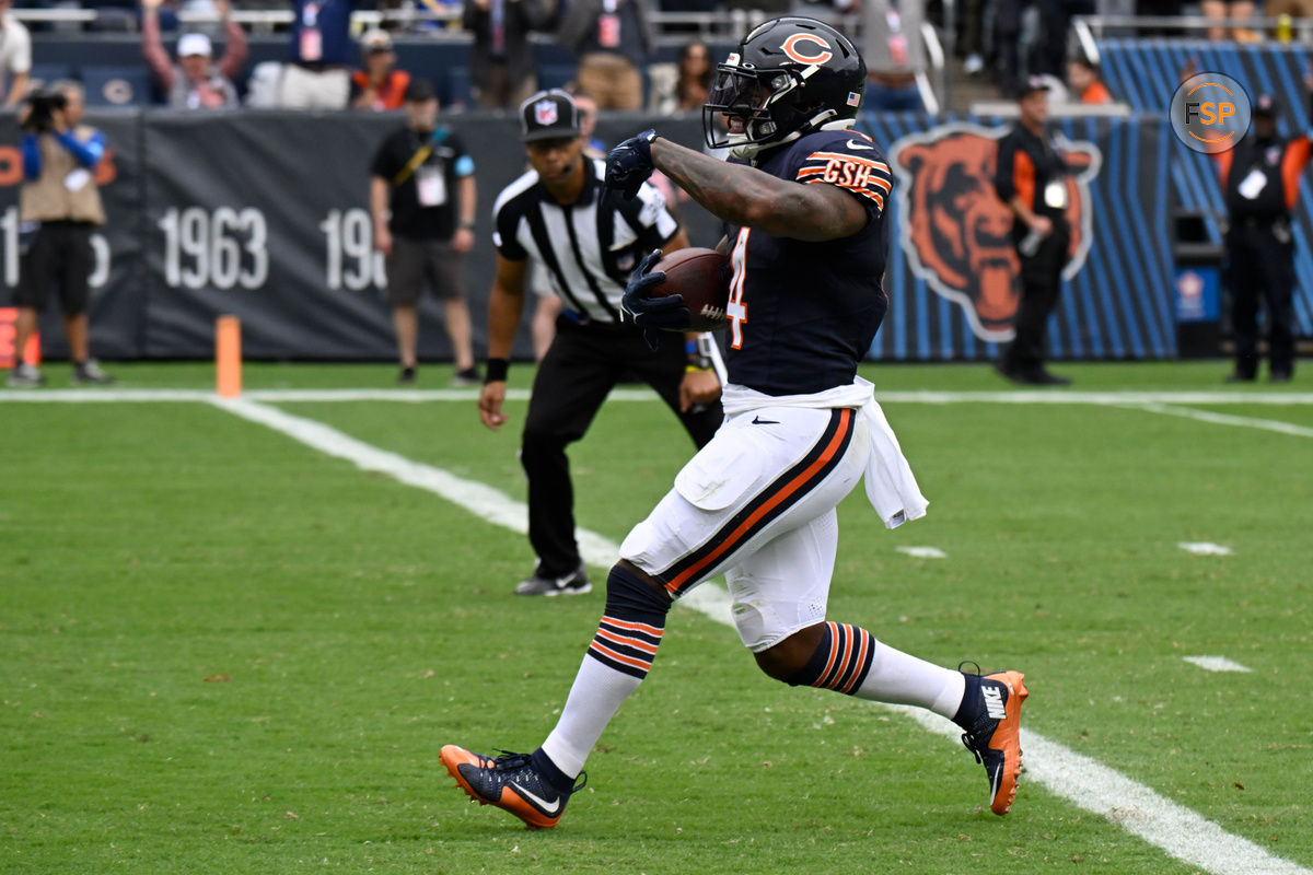 Sep 29, 2024; Chicago, Illinois, USA;  Chicago Bears running back D'Andre Swift (4) runs for a touchdown against the Los Angeles Rams during the second half at Soldier Field. Credit: Matt Marton-Imagn Images