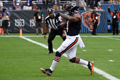 Sep 29, 2024; Chicago, Illinois, USA;  Chicago Bears running back D'Andre Swift (4) runs for a touchdown against the Los Angeles Rams during the second half at Soldier Field. Mandatory Credit: Matt Marton-Imagn Images