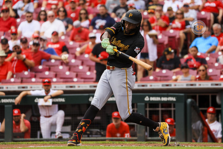 Sep 22, 2024; Cincinnati, Ohio, USA; Pittsburgh Pirates outfielder Oneil Cruz (15) hits a solo home run in the first inning against the Cincinnati Reds at Great American Ball Park. Credit: Katie Stratman-Imagn Images