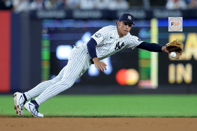 Aug 5, 2026; Bronx, New York, USA; New York Yankees shortstop George Lombard Jr. (96) makes a diving stop on a ground ball by St. Louis Cardinals shortstop JJ Wetherholt (not pictured) during the third inning at Yankee Stadium. Credit: Brad Penner-Imagn Images