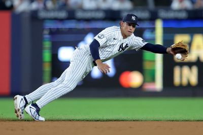 Aug 5, 2026; Bronx, New York, USA; New York Yankees shortstop George Lombard Jr. (96) makes a diving stop on a ground ball by St. Louis Cardinals shortstop JJ Wetherholt (not pictured) during the third inning at Yankee Stadium. Mandatory Credit: Brad Penner-Imagn Images