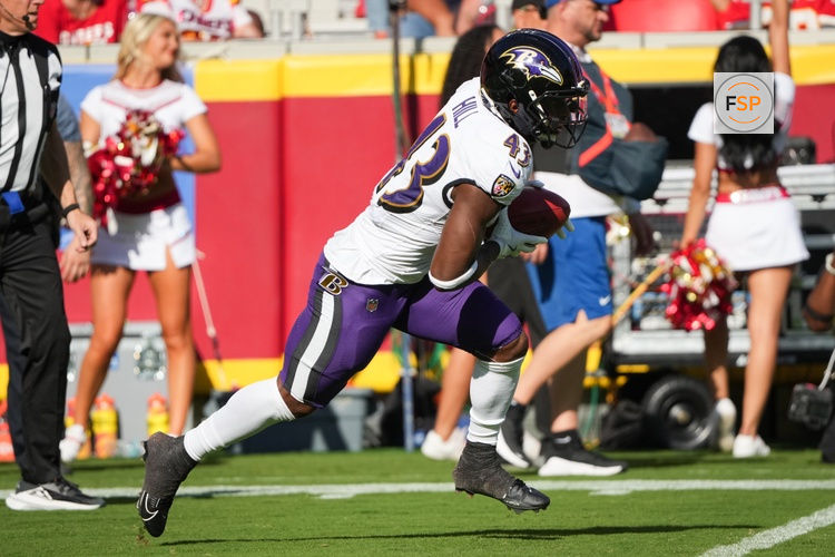 Sep 28, 2025; Kansas City, Missouri, USA;  Baltimore Ravens running back Justice Hill (43) runs with the ball during the second quarter against the Kansas City Chiefs at GEHA Field at Arrowhead Stadium. Credit: Denny Medley-Imagn Images