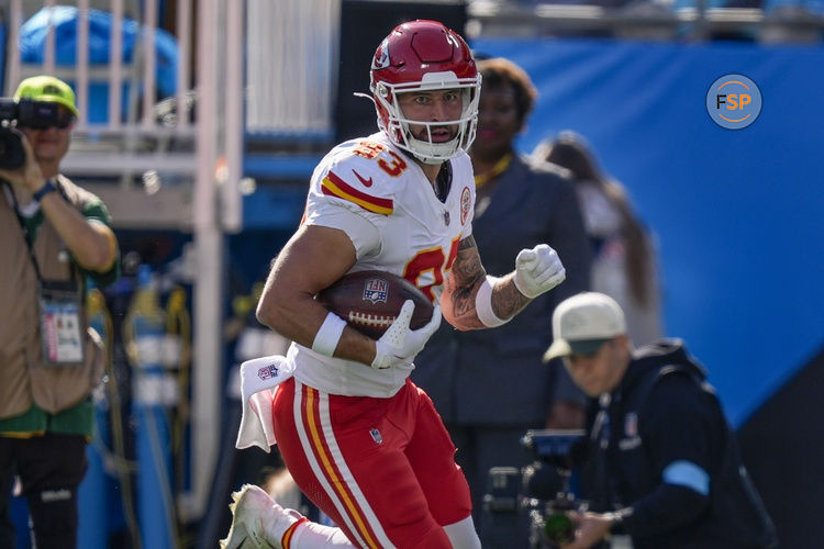 Nov 24, 2024; Charlotte, North Carolina, USA;  Kansas City Chiefs tight end Noah Gray (83) scores the opening touchdown pass against the Carolina Panthers during the first quarter at Bank of America Stadium. Credit: Jim Dedmon-Imagn Images