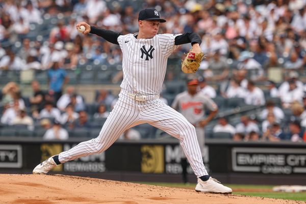 Jun 22, 2025; Bronx, New York, USA; New York Yankees starting pitcher Will Warren (98) delivers a pitch during the second inning against the Baltimore Orioles  at Yankee Stadium. Mandatory Credit: Vincent Carchietta-Imagn Images