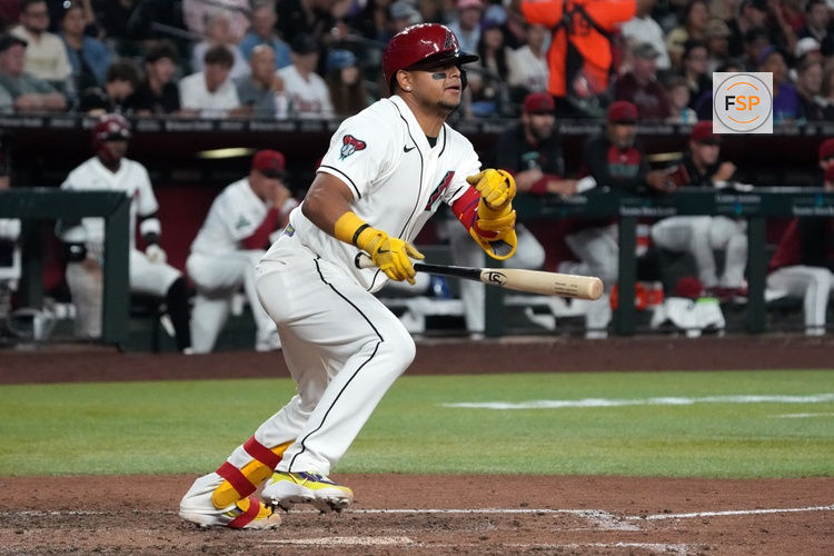 May 5, 2026; Phoenix, Arizona, USA; Arizona Diamondbacks catcher Gabriel Moreno (14) hits an RBI double against the Pittsburgh Pirates in the sixth inning at Chase Field. Credit: Rick Scuteri-Imagn Images