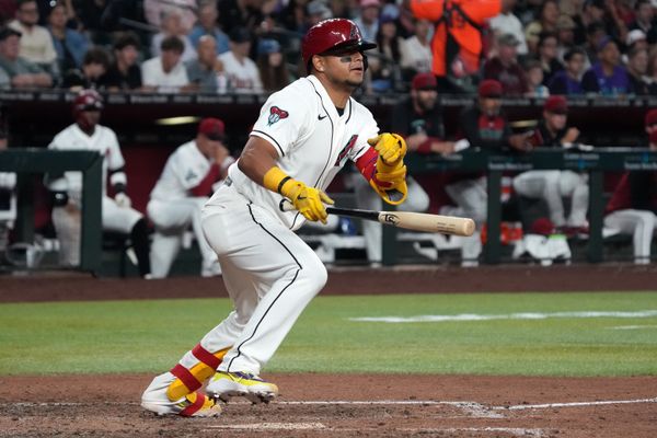 May 5, 2026; Phoenix, Arizona, USA; Arizona Diamondbacks catcher Gabriel Moreno (14) hits an RBI double against the Pittsburgh Pirates in the sixth inning at Chase Field. Mandatory Credit: Rick Scuteri-Imagn Images