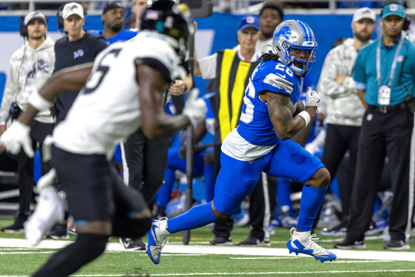 Nov 17, 2024; Detroit, Michigan, USA; Detroit Lions running back Jahmyr Gibbs (26) runs with the ball against the Jacksonville Jaguars during the first half at Ford Field. Mandatory Credit: David Reginek-Imagn Images