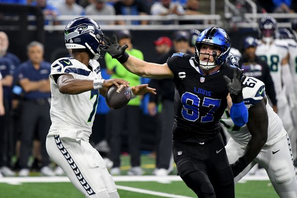 Sep 30, 2024; Detroit, Michigan, USA; Detroit Lions defensive end Aidan Hutchinson (97) rushes towards Seattle Seahawks quarterback Geno Smith (7) in the third quarter at Ford Field. Mandatory Credit: Eamon Horwedel-Imagn Images