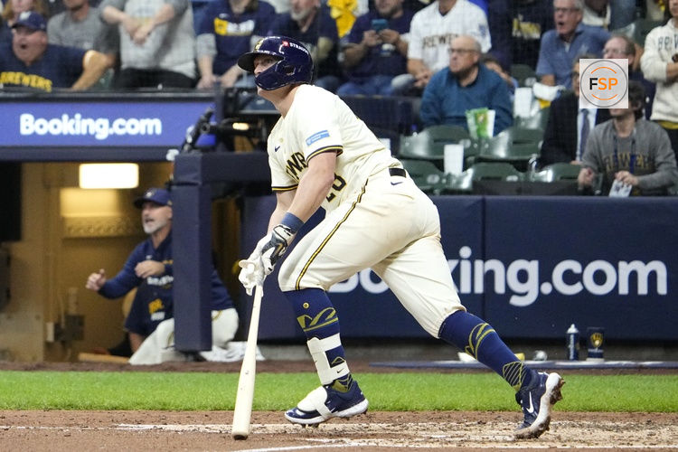 Oct 11, 2025; Milwaukee, Wisconsin, USA; Milwaukee Brewers first baseman Andrew Vaughn (28) hits a solo home run against the Chicago Cubs in the fourth inning during game five of the NLDS round for the 2025 MLB playoffs at American Family Field. Credit: Michael McLoone-Imagn Images