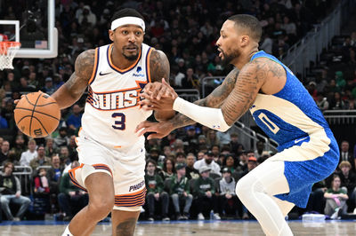 Mar 17, 2024; Milwaukee, Wisconsin, USA; Phoenix Suns guard Bradley Beal (3) drives against Milwaukee Bucks guard Damian Lillard (0) on the second half at Fiserv Forum. Mandatory Credit: Michael McLoone-USA TODAY Sports