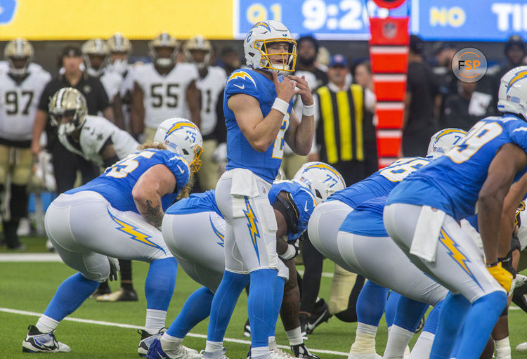 INGLEWOOD, CA - AUGUST 20: Los Angeles Chargers quarterback Easton Stick (2) signals to his sideline before a down in the first half of a preseason NFL football game between the New Orleans Saints and Los Angeles Chargers at SoFi Stadium in Inglewood, California. (Photo by Tony Ding/Icon Sportswire)