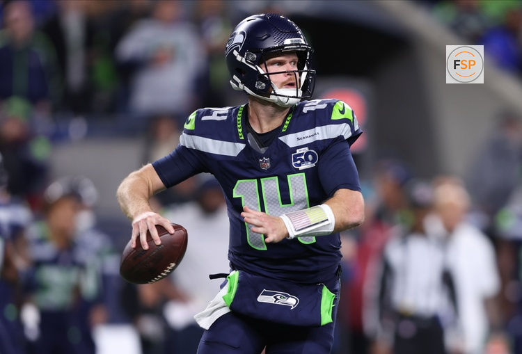Oct 20, 2025; Seattle, Washington, USA; Seattle Seahawks quarterback Sam Darnold (14) looks to throw a pass during the second quarter against the Houston Texans at Lumen Field. Credit: Kevin Ng-Imagn Images