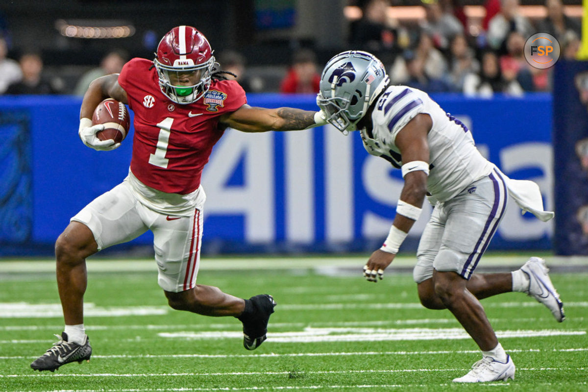 NEW ORLEANS, LA - DECEMBER 31: Alabama Crimson Tide running back Jahmyr Gibbs (1) stiff arms Kansas State Wildcats safety Drake Cheatum (21) during first half action during the Sugar Bowl between the Alabama Crimson Tide and Kansas State Wildcats at Caesars Superdome on December 31, 2022 in New Orleans, LA. (Photo by Ken Murray/Icon Sportswire)