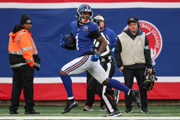 Dec 29, 2024; East Rutherford, New Jersey, USA; New York Giants wide receiver Malik Nabers (1) scores on a touchdown reception during the second half against the Indianapolis Colts at MetLife Stadium. Mandatory Credit: Vincent Carchietta-Imagn Images