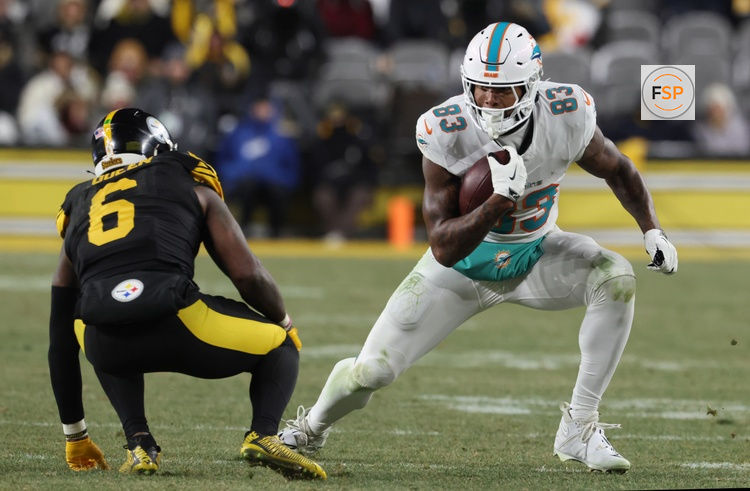 Dec 15, 2025; Pittsburgh, Pennsylvania, USA; Miami Dolphins tight end Darren Waller (83) moves with the ball in the fourth quarter against the Pittsburgh Steelers at Acrisure Stadium. Credit: Charles LeClaire-Imagn Images