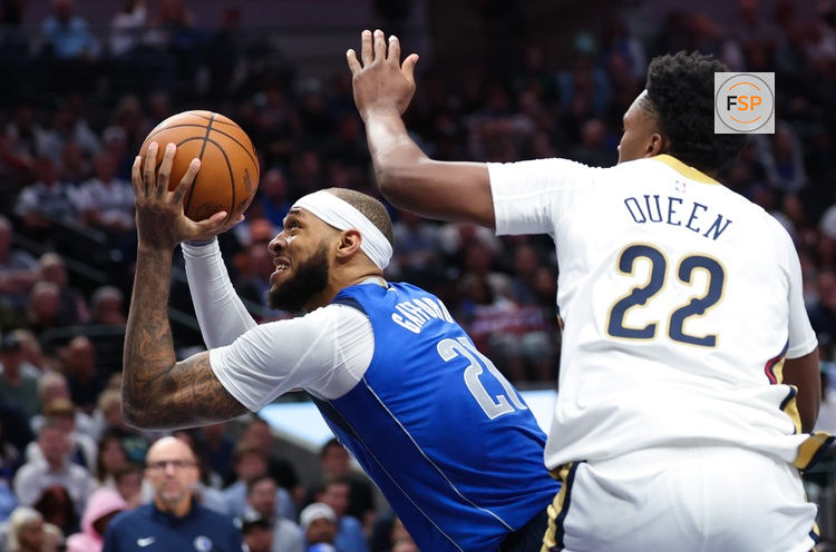 Nov 5, 2025; Dallas, Texas, USA;  Dallas Mavericks forward Daniel Gafford (21) looks to score as New Orleans Pelicans center Derik Queen (22) defends during the second half at American Airlines Center. Credit: Kevin Jairaj-Imagn Images