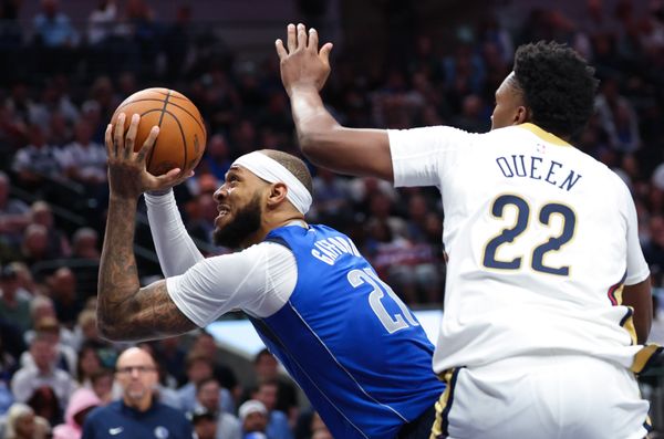 Nov 5, 2025; Dallas, Texas, USA;  Dallas Mavericks forward Daniel Gafford (21) looks to score as New Orleans Pelicans center Derik Queen (22) defends during the second half at American Airlines Center. Mandatory Credit: Kevin Jairaj-Imagn Images