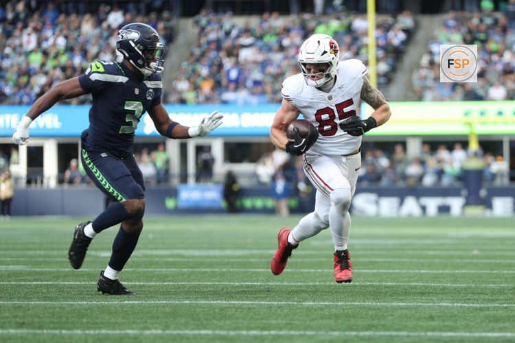 Nov 9, 2025; Seattle, Washington, USA; Arizona Cardinals tight end Trey McBride (85) rushes as Seattle Seahawks safety Nick Emmanwori (3) defends during the second quarter at Lumen Field. Credit: Kevin Ng-Imagn Images