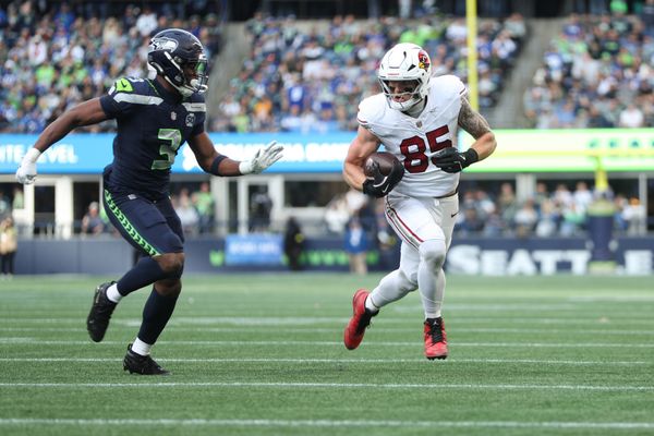 Nov 9, 2025; Seattle, Washington, USA; Arizona Cardinals tight end Trey McBride (85) rushes as Seattle Seahawks safety Nick Emmanwori (3) defends during the second quarter at Lumen Field. Mandatory Credit: Kevin Ng-Imagn Images