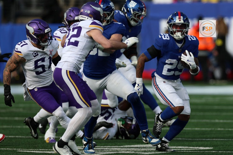 Dec 21, 2025; East Rutherford, New Jersey, USA; New York Giants running back Tyrone Tracy Jr. (29) rushes the ball against the Minnesota Vikings during the first half at MetLife Stadium. Credit: Vincent Carchietta-Imagn Images