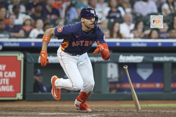 May 25, 2025; Houston, Texas, USA; Houston Astros right fielder Cam Smith (11) hits an RBI single during the sixth inning against the Seattle Mariners at Daikin Park. Credit: Troy Taormina-Imagn Images