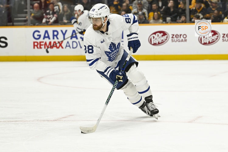 Dec 20, 2025; Nashville, Tennessee, USA;  Toronto Maple Leafs right wing William Nylander (88) skates with the puck against the Nashville Predators during the first period at Bridgestone Arena. Credit: Steve Roberts-Imagn Images