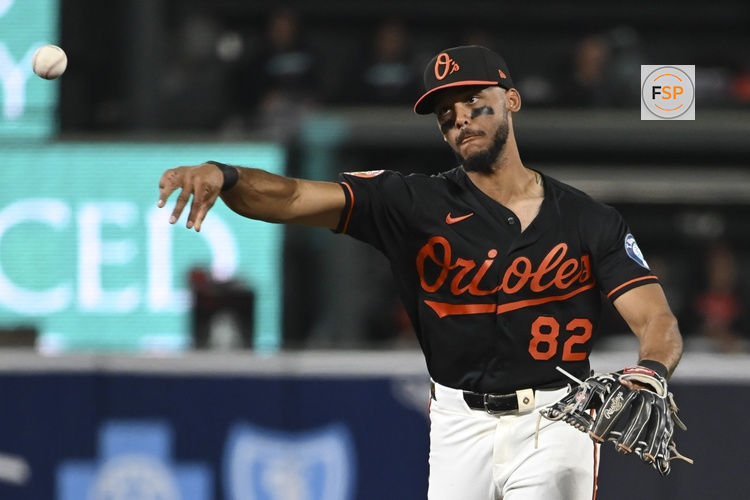 Apr 13, 2026; Baltimore, Maryland, USA;  Baltimore Orioles second baseman Jeremiah Jackson (82) throws to first base run the eighth inning against the Arizona Diamondbacks at Oriole Park at Camden Yards. Credit: Tommy Gilligan-Imagn Images