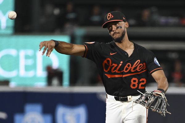 Apr 13, 2026; Baltimore, Maryland, USA;  Baltimore Orioles second baseman Jeremiah Jackson (82) throws to first base run the eighth inning against the Arizona Diamondbacks at Oriole Park at Camden Yards. Mandatory Credit: Tommy Gilligan-Imagn Images