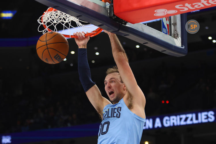 Jan 22, 2025; Memphis, Tennessee, USA; Memphis Grizzlies guard Luke Kennard (10) dunks during the fourth quarter against the Charlotte Hornets at FedExForum. Credit: Petre Thomas-Imagn Images