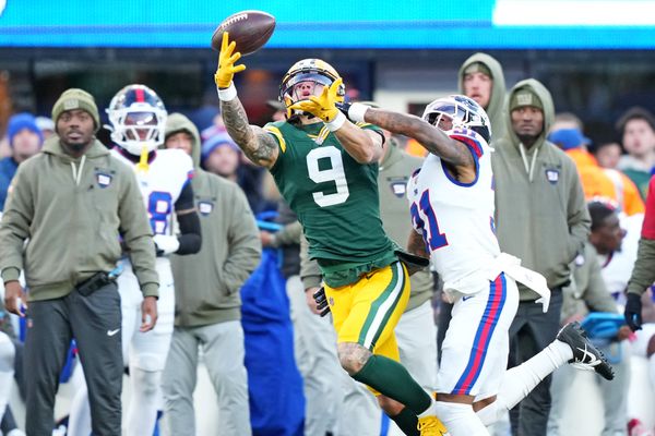Nov 16, 2025; East Rutherford, New Jersey, USA; Green Bay Packers wide receiver Christian Watson (9) reaches for the ball but can not make the catch against New York Giants cornerback Nic Jones (31) during the third quarter at MetLife Stadium. Mandatory Credit: Robert Deutsch-Imagn Images