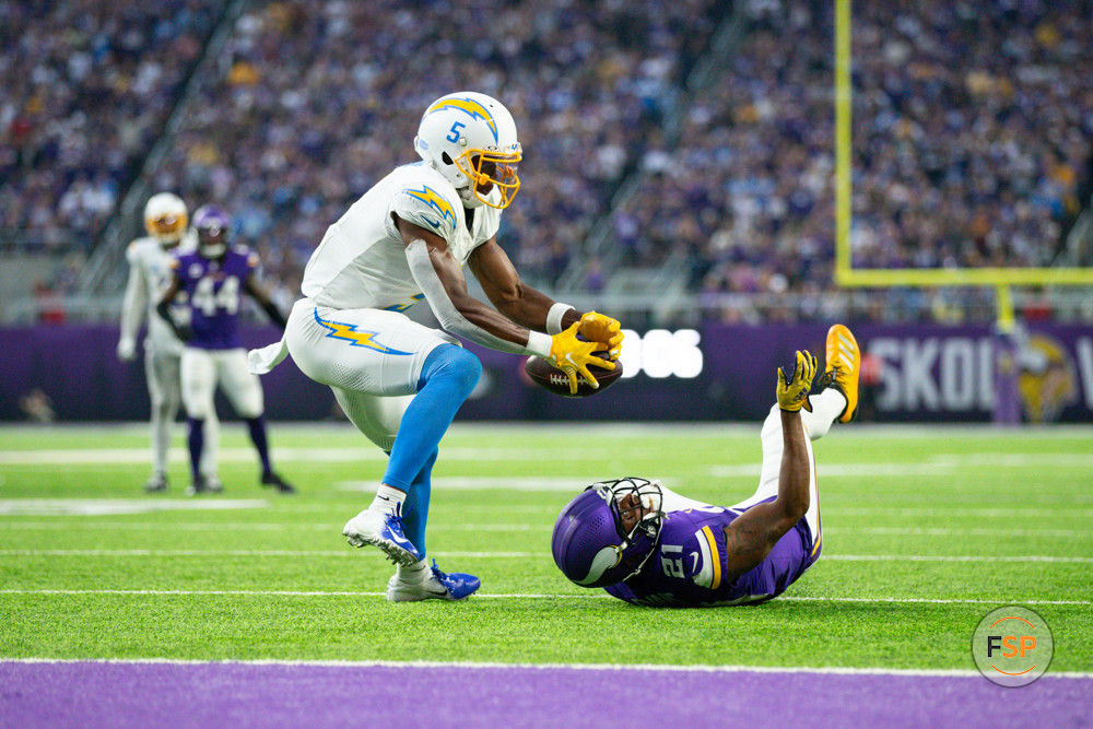 MINNEAPOLIS, MN - SEPTEMBER 24: Los Angeles Chargers wide receiver Joshua Palmer (5) catches a tipped ball from Minnesota Vikings cornerback Akayleb Evans (21) for a touchdown during the NFL game between the Los Angles Chargers and the Minnesota Vikings on September 24th, 2023, at U.S. Bank Stadium in Minneapolis, MN. (Photo by Bailey Hillesheim/Icon Sportswire)