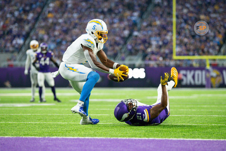 MINNEAPOLIS, MN - SEPTEMBER 24: Los Angeles Chargers wide receiver Joshua Palmer (5) catches a tipped ball from Minnesota Vikings cornerback Akayleb Evans (21) for a touchdown during the NFL game between the Los Angles Chargers and the Minnesota Vikings on September 24th, 2023, at U.S. Bank Stadium in Minneapolis, MN. (Photo by Bailey Hillesheim/Icon Sportswire)