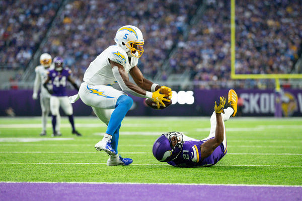 MINNEAPOLIS, MN - SEPTEMBER 24: Los Angeles Chargers wide receiver Joshua Palmer (5) catches a tipped ball from Minnesota Vikings cornerback Akayleb Evans (21) for a touchdown during the NFL game between the Los Angles Chargers and the Minnesota Vikings on September 24th, 2023, at U.S. Bank Stadium in Minneapolis, MN. (Photo by Bailey Hillesheim/Icon Sportswire)