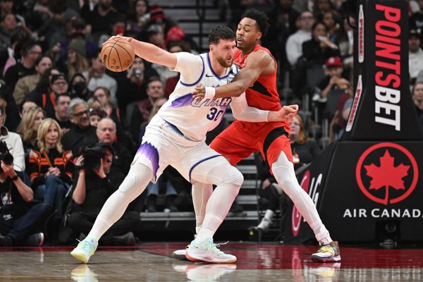 Feb 1, 2026; Toronto, Ontario, CAN;  Utah Jazz center Jusuf Nurkic (30) holds the ball away from Toronto Raptors forward Scottie Barnes (4) in the first half at Scotiabank Arena. Mandatory Credit: Dan Hamilton-Imagn Images