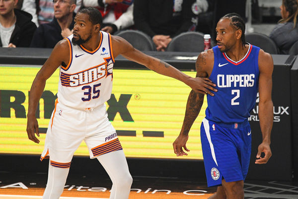LOS ANGELES, CA - JANUARY 08: Phoenix Suns Forward Kevin Durant (35) and Los Angeles Clippers Forward Kawhi Leonard (2) look on during a NBA game between the Phoenix Suns and the Los Angeles Clippers on January 8, 2023 at Crypto.com Arena in Los Angeles, CA. (Photo by Brian Rothmuller/Icon Sportswire)