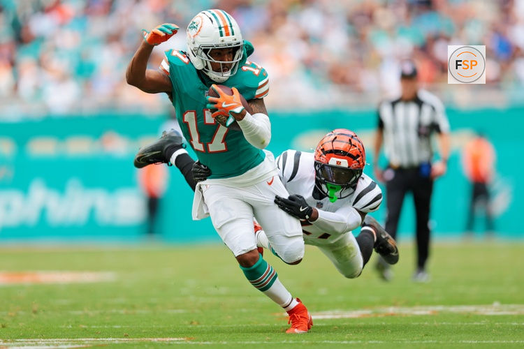 Dec 21, 2025; Miami Gardens, Florida, USA; Miami Dolphins wide receiver Jaylen Waddle (17) runs the ball during the second quarter against the Cincinnati Bengals at Hard Rock Stadium. Credit: Sam Navarro-Imagn Images