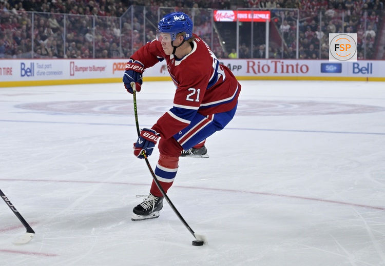 Oct 14, 2025; Montreal, Quebec, CAN; Montreal Canadiens defenseman Kaiden Guhle (21) takes a shot on net during the second period of the game against the Seattle Kraken at the Bell Centre. Credit: Eric Bolte-Imagn Images