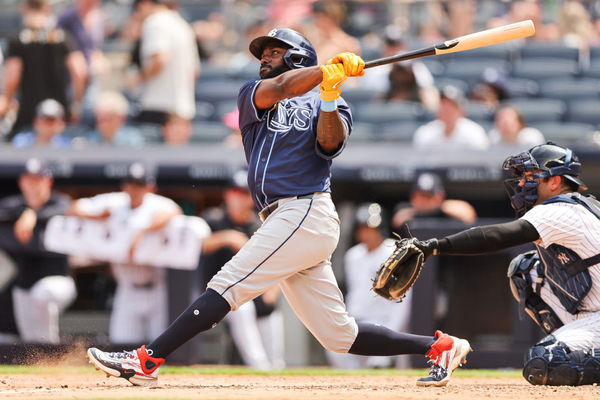 BRONX, NY - JULY 20: Tampa Bay Rays outfielder Randy Arozarena (56) hits a home run during a game between the Tampa Bay Rays and the New York Yankees on July 20, 2024 at Yankee Stadium in the Bronx, New York. (Photo by Andrew Mordzynski/Icon Sportswire)