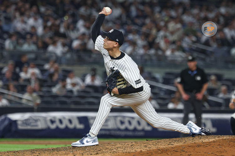 May 2, 2025; Bronx, New York, USA; New York Yankees relief pitcher Luke Weaver (30) delivers a pitch during the ninth inning against the Tampa Bay Rays at Yankee Stadium. Credit: Vincent Carchietta-Imagn Images