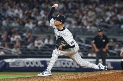 May 2, 2025; Bronx, New York, USA; New York Yankees relief pitcher Luke Weaver (30) delivers a pitch during the ninth inning against the Tampa Bay Rays at Yankee Stadium. Mandatory Credit: Vincent Carchietta-Imagn Images