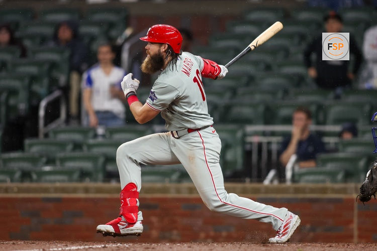 Apr 25, 2026; Atlanta, Georgia, USA; Philadelphia Phillies left fielder Brandon Marsh (16) hits an two-run single against the Atlanta Braves in the tenth inning at Truist Park. Credit: Brett Davis-Imagn Images