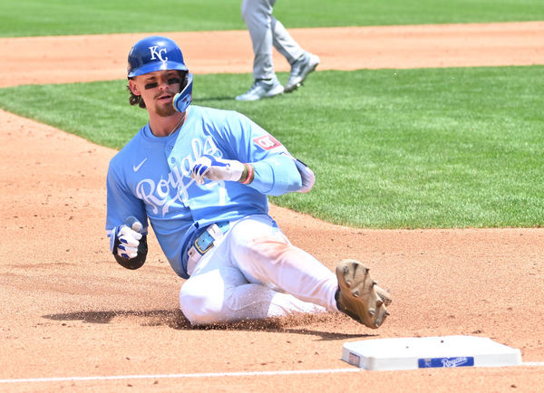 KANSAS CITY, MO - MAY 19: Kansas City Royals shortstop Bobby Witt Jr (7) slides safely into third after hitting a triple during a MLB game between the Oakland Athletics and the Kansas City Royals on May 19, 2024, at Kauffman Stadium, Kansas City, MO.  (Photo by Keith Gillett/Icon Sportswire)