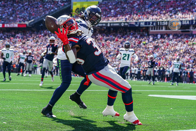 Sep 15, 2024; Foxborough, Massachusetts, USA; New England Patriots running back Rhamondre Stevenson (38) misses the pass against Seattle Seahawks linebacker Jerome Baker (17) in the second quarter at Gillette Stadium. Credit: David Butler II-Imagn Images