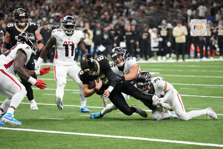 Nov 23, 2025; New Orleans, Louisiana, USA; New Orleans Saints quarterback Tyler Shough (6) is tackled short of the goal line by Atlanta Falcons safety Jessie Bates III (3) and linebacker Kaden Elliss (55) during the second half at Caesars Superdome. Credit: Matthew Hinton-Imagn Images