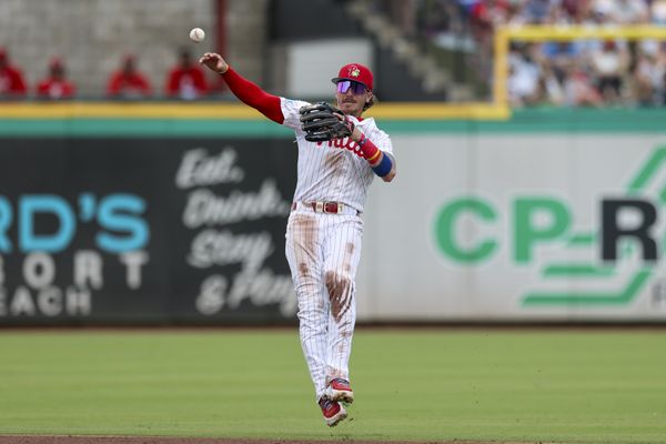 Mar 15, 2026; Clearwater, Florida, USA; Philadelphia Phillies second baseman Bryson Stott (5) trows to first for an out against the Atlanta Braves in the third inning during spring training at BayCare Ballpark. Mandatory Credit: Nathan Ray Seebeck-Imagn Images