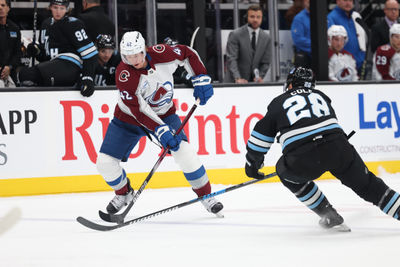 Oct 24, 2024; Salt Lake City, Utah, USA; Colorado Avalanche defenseman Josh Manson (42) skates with the puck while Utah Hockey Club defenseman Ian Cole (28) defends during the first period at Delta Center. Mandatory Credit: Rob Gray-Imagn Images