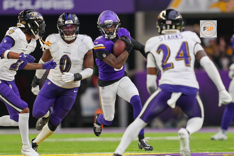 Nov 9, 2025; Minneapolis, Minnesota, USA; Minnesota Vikings wide receiver Jordan Addison (3) runs after the catch against Baltimore Ravens linebacker Roquan Smith (0) in the fourth quarter at U.S. Bank Stadium. Credit: Brad Rempel-Imagn Images