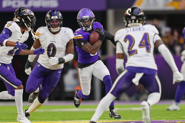 Nov 9, 2025; Minneapolis, Minnesota, USA; Minnesota Vikings wide receiver Jordan Addison (3) runs after the catch against Baltimore Ravens linebacker Roquan Smith (0) in the fourth quarter at U.S. Bank Stadium. Mandatory Credit: Brad Rempel-Imagn Images