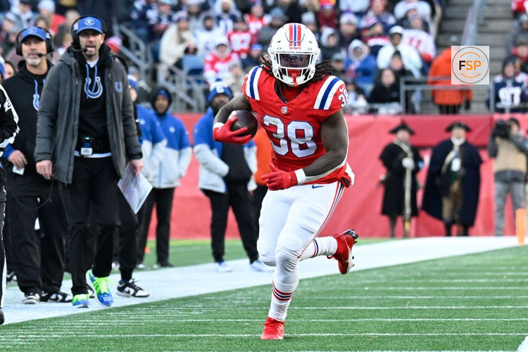 Dec 1, 2024; Foxborough, Massachusetts, USA; New England Patriots running back Rhamondre Stevenson (38) runs the ball during the first half against the Indianapolis Colts at Gillette Stadium. Credit: Eric Canha-Imagn Images
